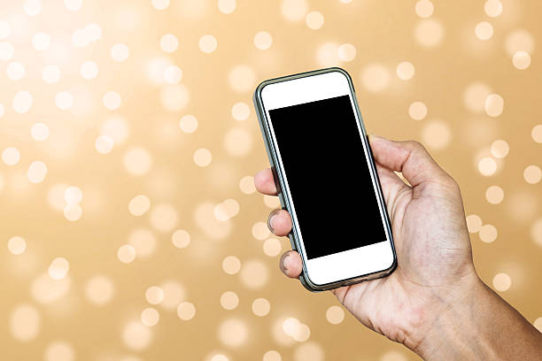 istock Hand using Smartphone taking a Photo of Defocus Bokeh Lights 628839564