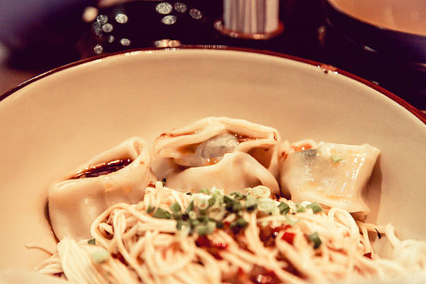 istock Chinese noodle with dumplings 628845560