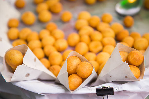 thai fried sweet potato balls for sale in market .