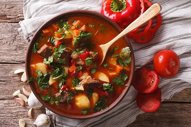 Photo of Traditional Hungarian goulash soup bogracs close-up in a bowl