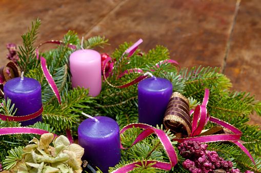 A Scandinavian-style advent wreaths, adorned with pristine red wax candles.