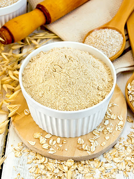 istock Flour oat in white bowl with bran and flakes 628864236