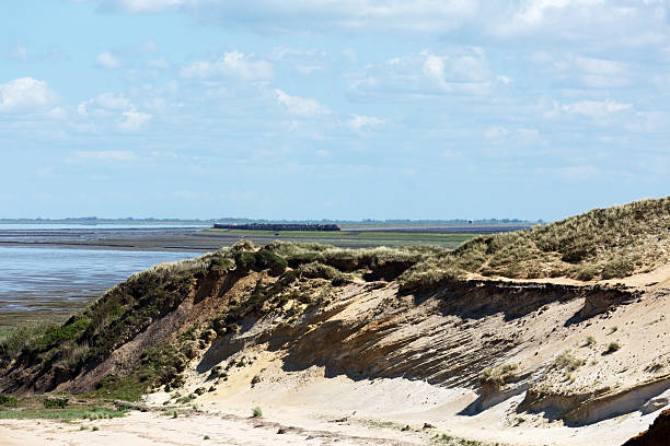 istock Sylt Morsum Cliff with Hindenburg Dam /Germany 628867524