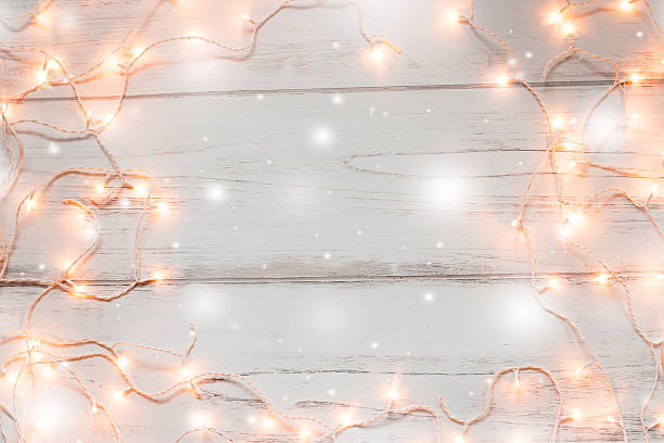 istock Christmas lights wooden background 628867574