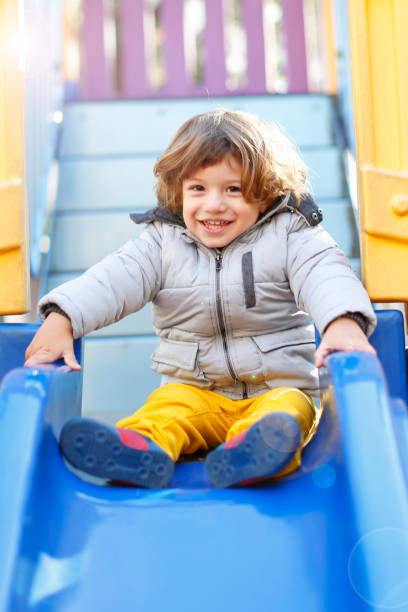istock Happy baby boy enjoying in the Playground 628873634