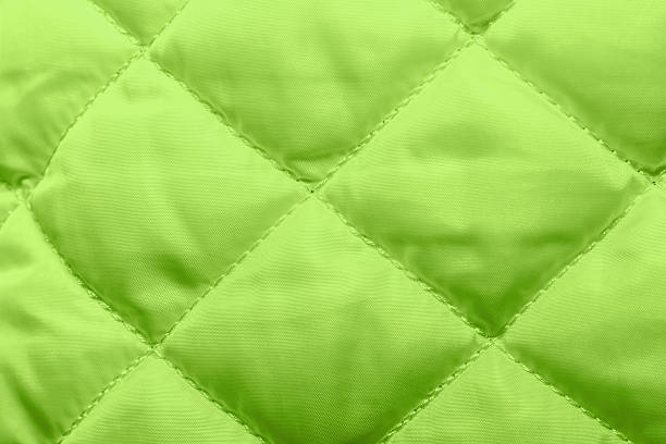 istock quilted fabric texture of white color for hammering, 628875472