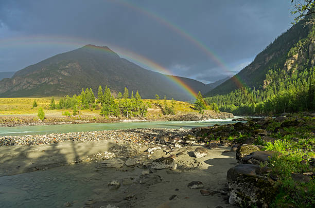 istock Rainbow over the river. Altai Mountains, Russia. 628884182