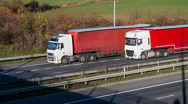istock Road transport - two lorries on the motorway 628885714