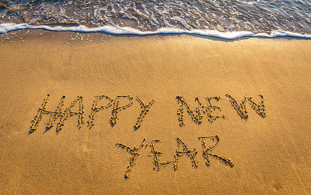 istock Hapy New Year 2017 concept, lettering on the beach 628896296