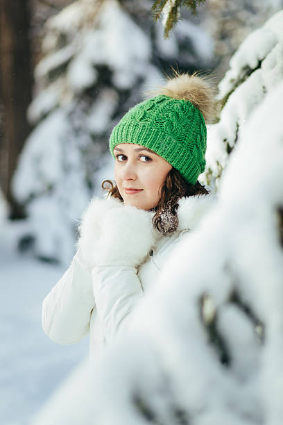 istock young woman in winter park 628899308