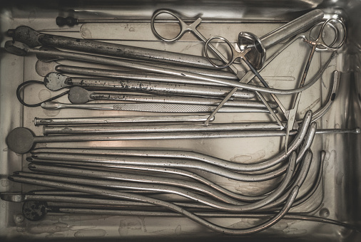 Sterilization of surgical instruments. Set of steel urological catheters. Vintage medical tools