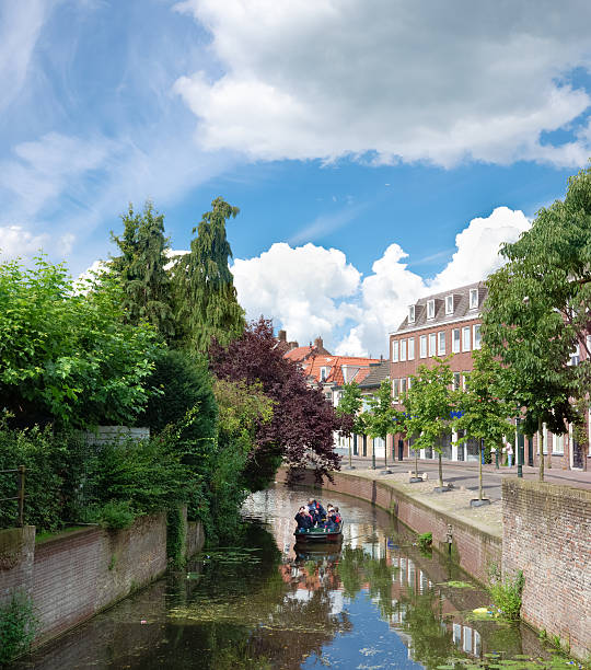 Amersfoort, netherlands - August 24, 2014: sightseeing boat in a canal in. The old town part has a medieval character with canals.
