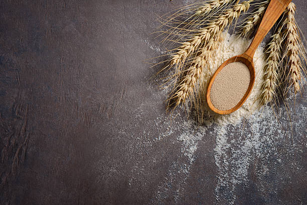 istock Baking background with dry yeast in a spoon 628899942