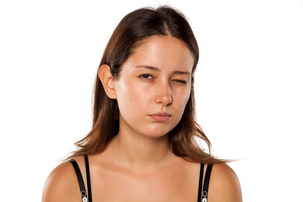 istock young beautiful woman with one eye closed 628900678