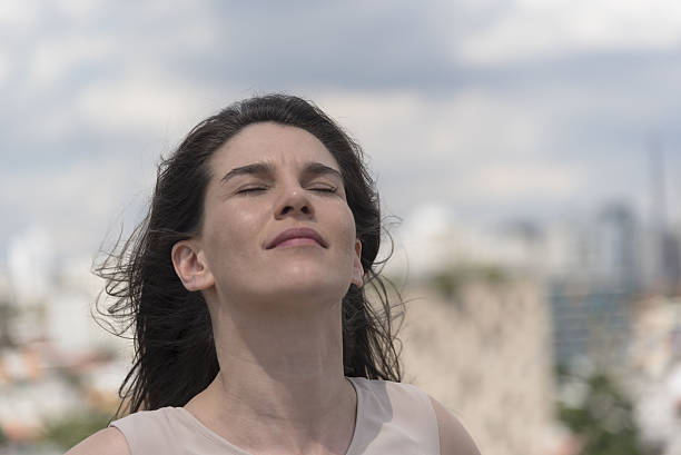 istock Confident young woman in the sun 628908606