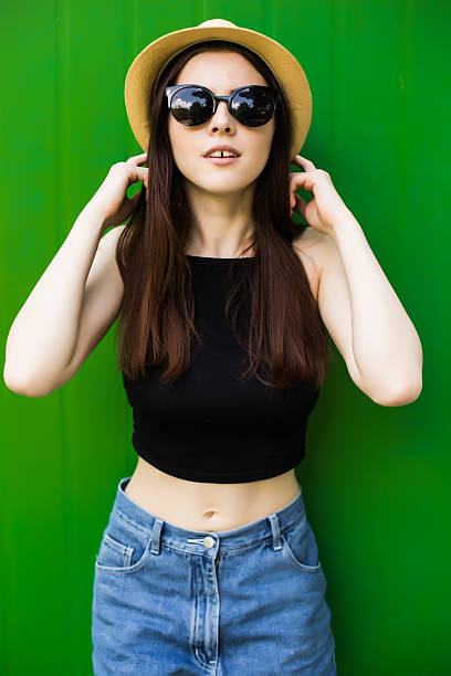 istock Beautiful girl on green background 628917414