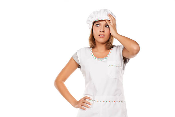 istock young beautiful woman posing with a chef's apron and cap 628917636