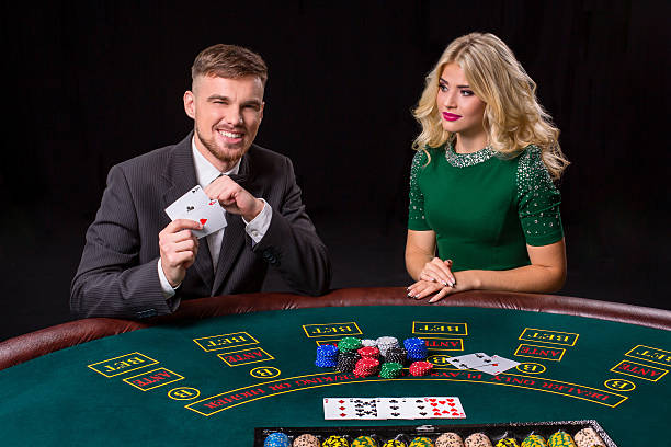 istock couple playing poker at the table. 628923804