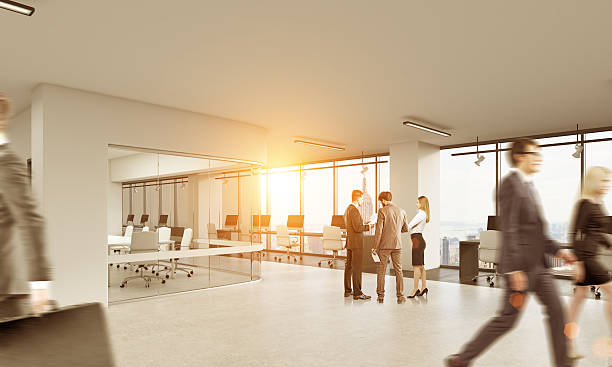 istock People talking in office with glass conference room 628932008
