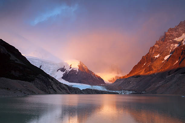 istock The rays of dawn over the mountain lake. 628932376