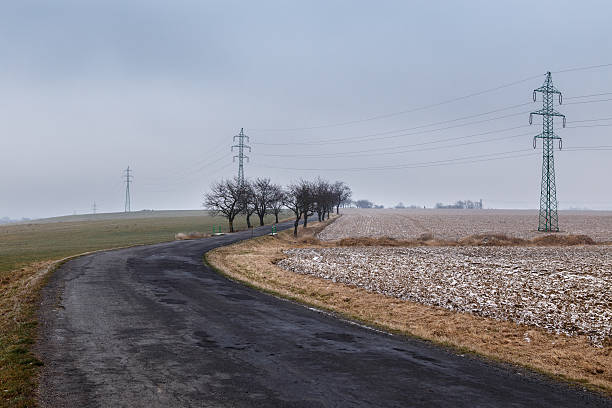 istock Rural road through a field covered with frost 628932678