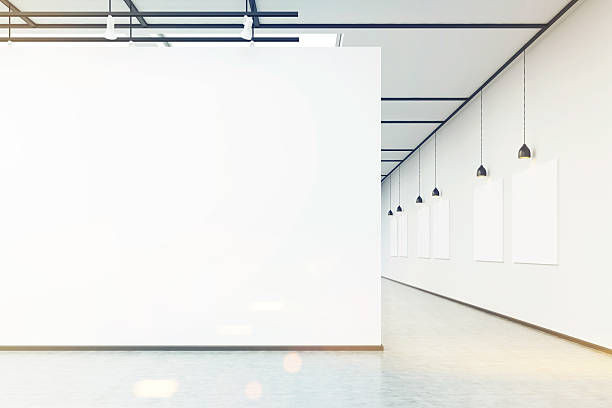istock Art gallery with large white wall and pictures, toned 628934214