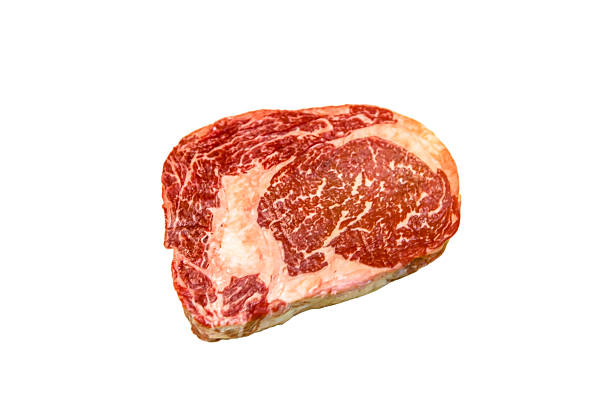 raw ribeye beef lies on a white background. marbled meat. - scotch steak imagens e fotografias de stock