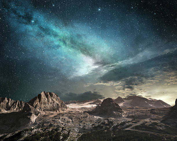 milky way at dawn in a mountain landscape milky way at dawn on a mountain landscape extreme terrain stock pictures, royalty-free photos & images