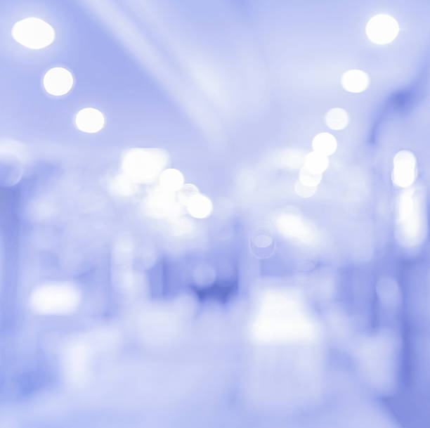 istock blurred blue  corridor in hall of hotel with beautiful light 628949664