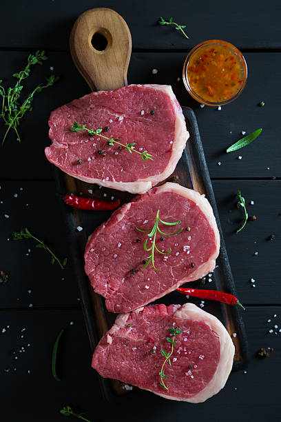 istock Raw steaks and spices 628949798