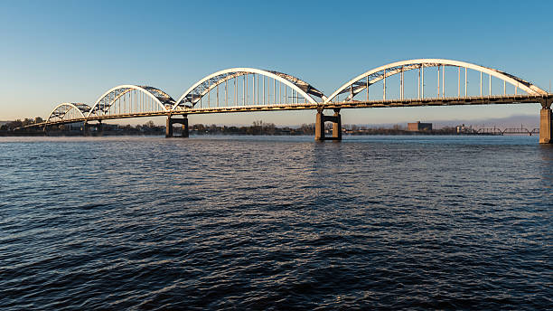 Centennial Bridge Crosses the Mississippi River Centennial Bridge Crosses the Mississippi River from Davenport, Iowa to Moline, Illinois davenport iowa stock pictures, royalty-free photos & images