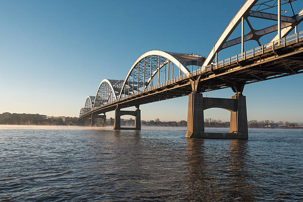 Centennial Bridge Crosses the Mississippi River Centennial Bridge Crosses the Mississippi River from Davenport, Iowa to Moline, Illinois illinois stock pictures, royalty-free photos & images