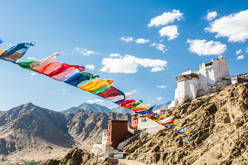 Tibetan Buddhist prayer flags in Tsemo castle in Leh in the Himalayas mountain range in Ladakh, India