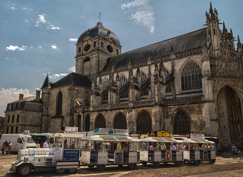 Alencon, Orne, Normandy, France - July 16, 2015: A tourist train near Basilica of Notre Dame of Alencon, Alencon centre.