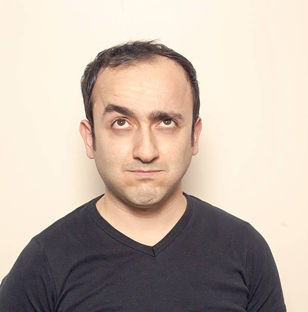 istock Young man making facial expressions 628963520