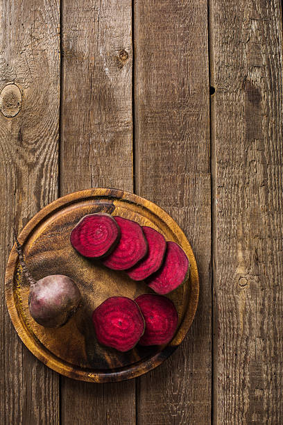 istock sliced on beetroot slate and wooden counter top background 628963780