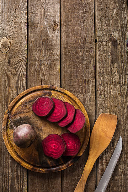 istock sliced on beetroot slate and wooden counter top background 628963900
