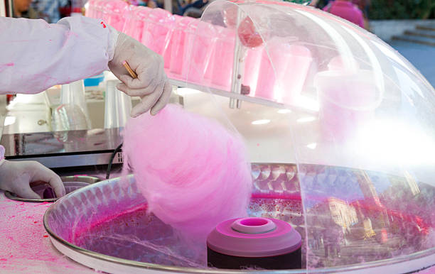 Man doing cotton candy stock photo