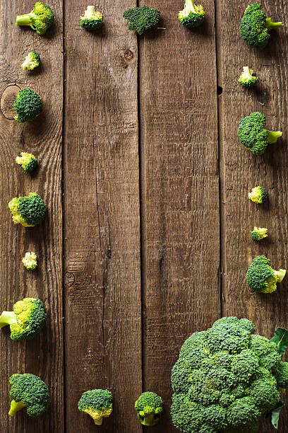 istock broccoli on slate and wooden counter top background 628965524