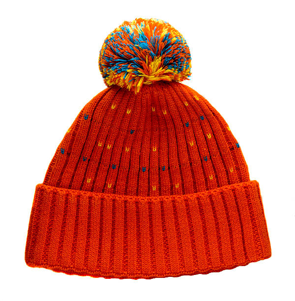 knitted hat isolated on white background .hat with pompon .orange in a colorful speckled   hat .