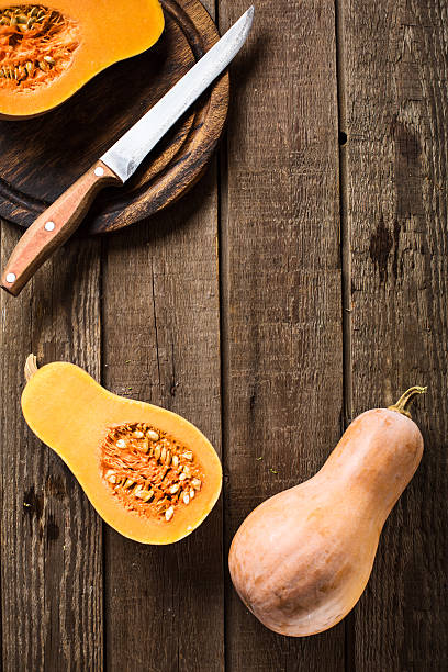istock sliced pumpkin squash on slate and wooden counter top background 628966452