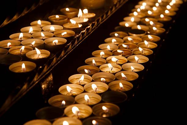 istock Candles in a dark church 628966976