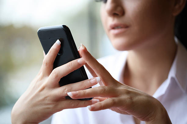 istock Businesswoman Text Messaging 628967618