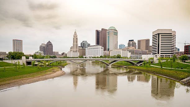 istock Columbus Ohio skyline and rain in the river bridge 628975394