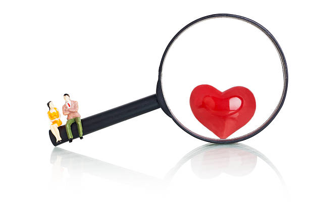 istock Couple Sit On The Magnifying Glass 628976716