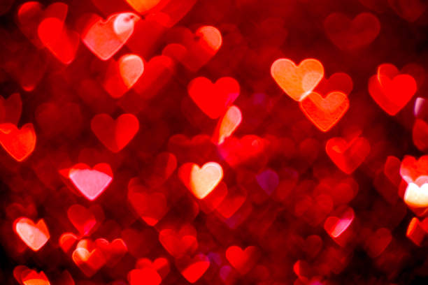istock Red heart bokeh background. Valentines day texture. 628977710