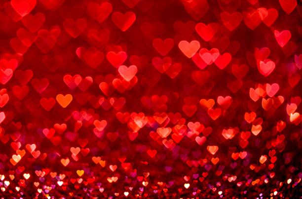 istock Red heart bokeh background. Valentines day texture. 628977772