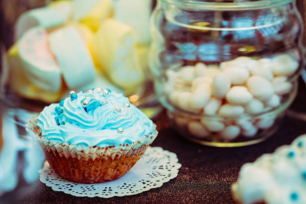 istock Dessert Sweet Tasty cupcake in Candy Bar On Table 628984070