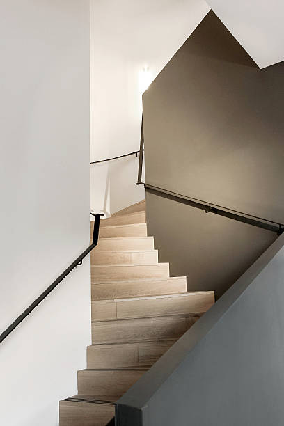 istock modern wooden stairs between walls 628984286