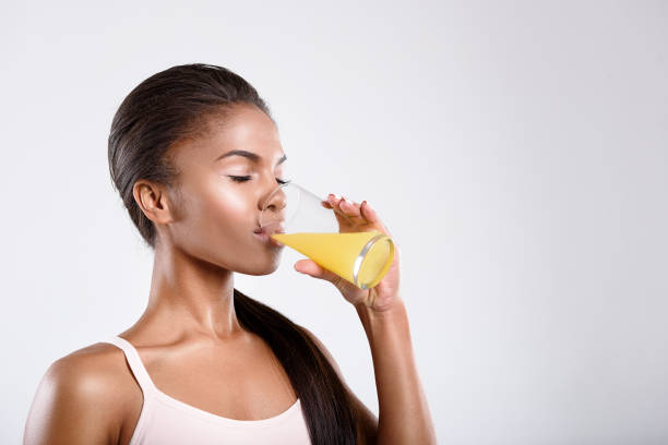 istock Calm fit woman is drinking juice 628986486